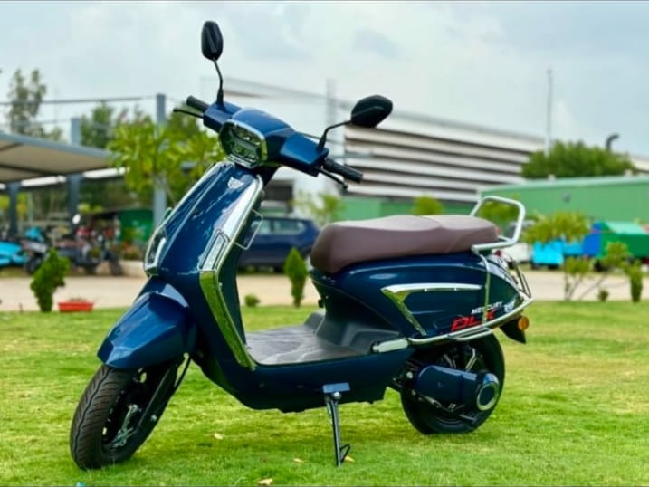 DLX Non-RTO electric scooter in royal blue, side view